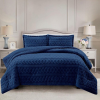 Simon Baker Brooklyn jacquard comforter set with plush sherpa fleece lining on a styled bed in colour Navy