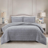 Simon Baker Brooklyn jacquard comforter set with plush sherpa fleece lining on a styled bed in colour Platinum